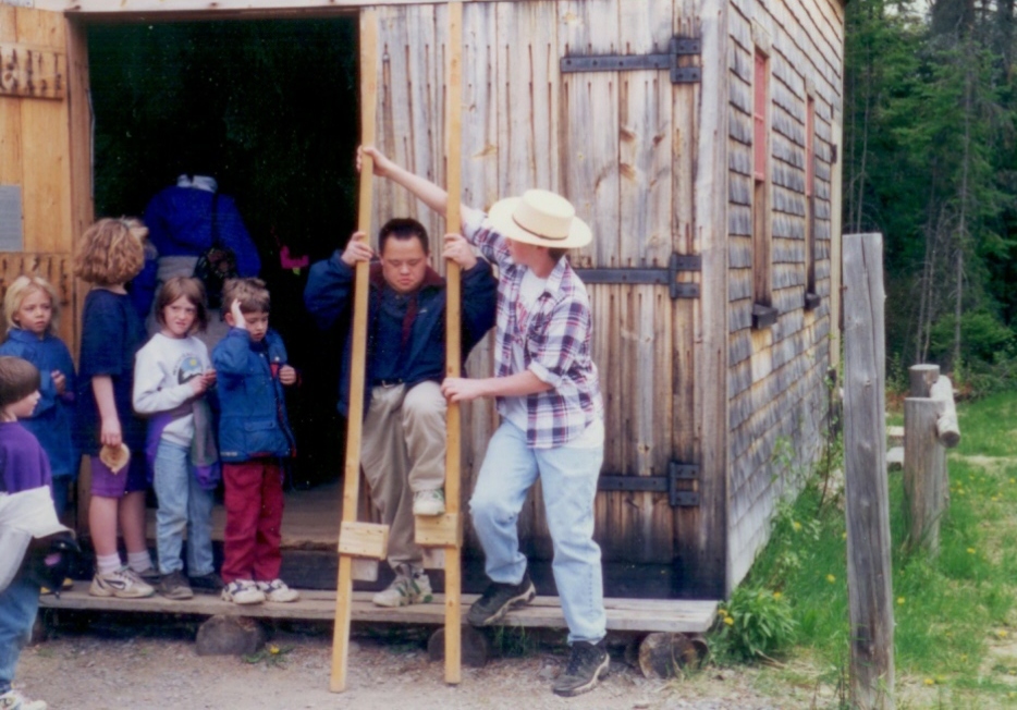 Children's Days: adult helping kid with stilts.